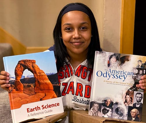 girl with science book and history book